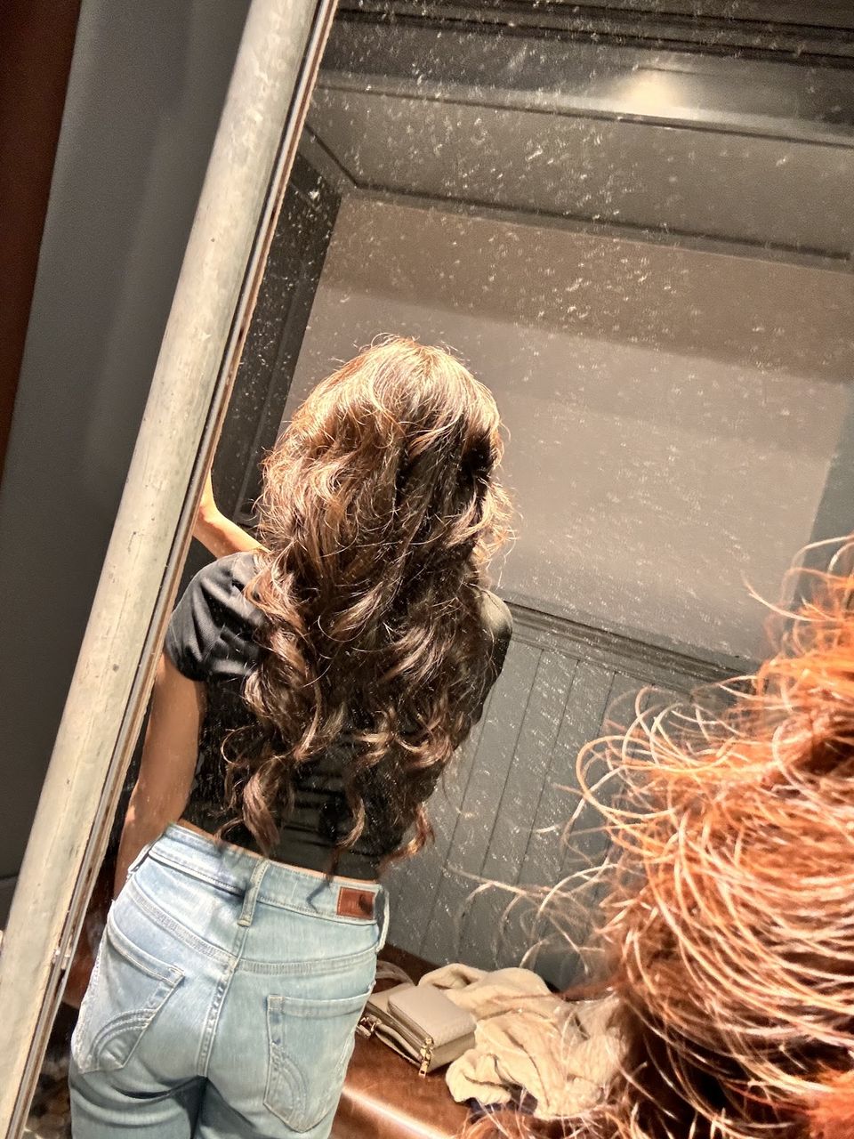 Long brunette waves after a color and style at Curl Up And Dye
